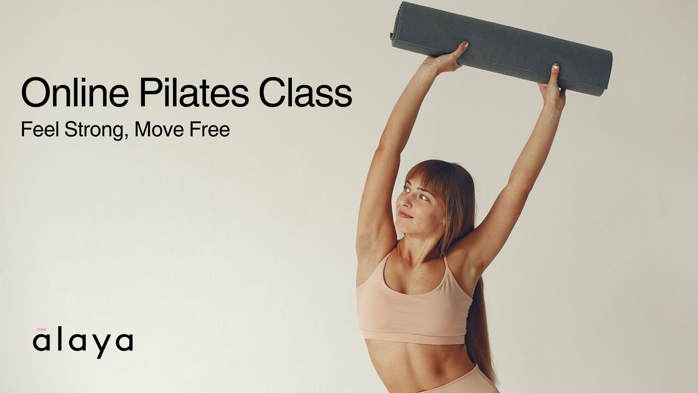 Woman lifting yoga mat, symbolising empowerment and strength in online Pilates and how those best home pilates workouts are helpful for beginners